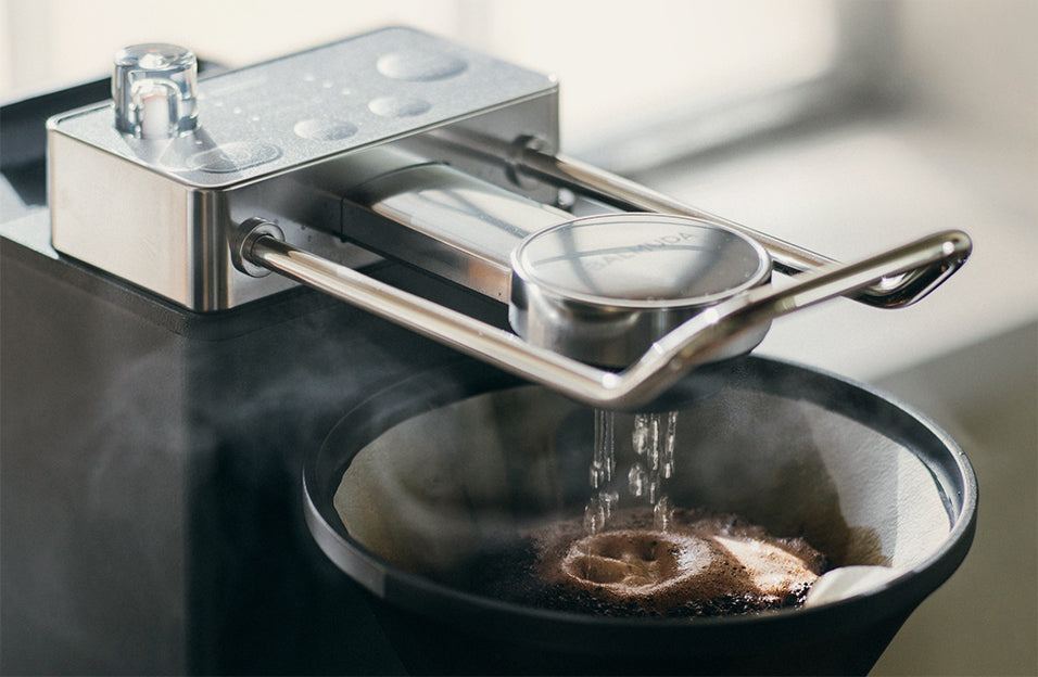 Hot water falling onto coffee grounds in BALMUDA The Brew
