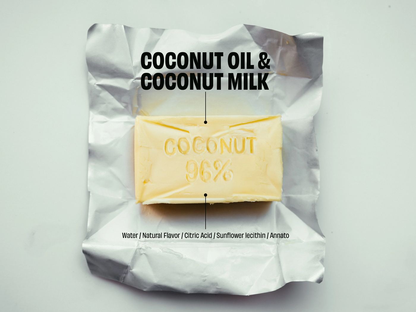 An unwrapped block of Better Than Butter stamped “Coconut 96%”