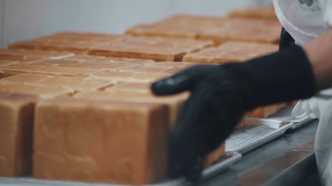 Rows of freshly baked square shokupan loaves