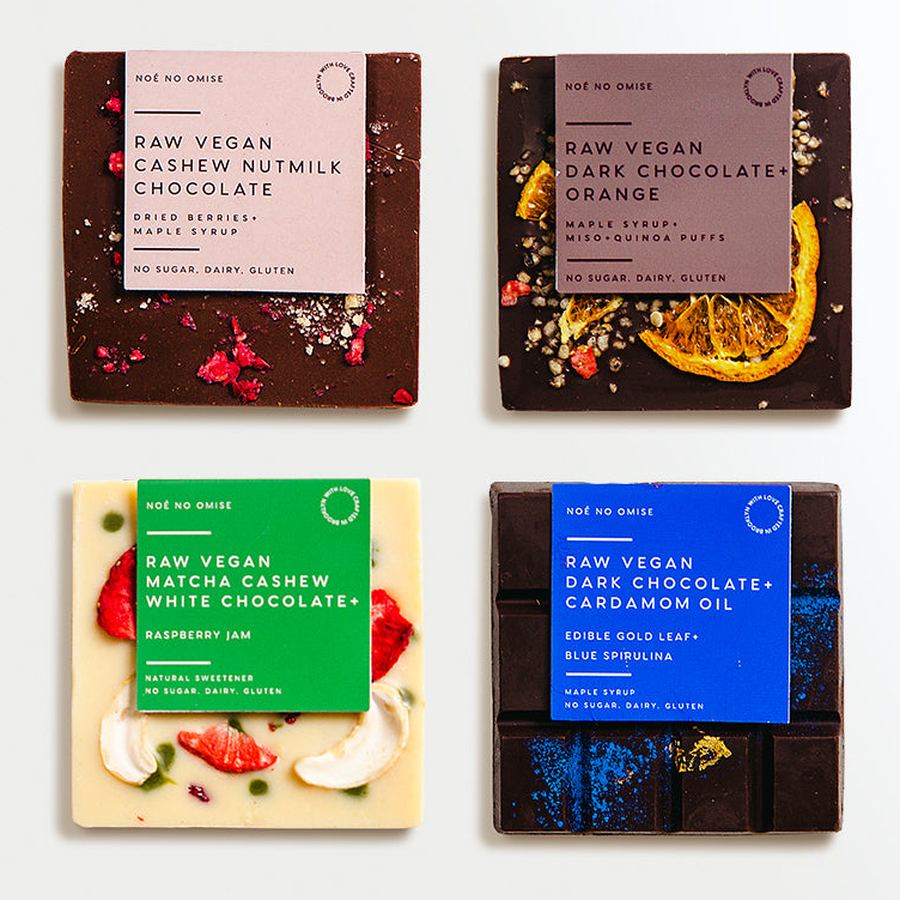 Four small NOÉ NO OMISE bars: cashew nutmilk, orange, matcha cashew and cardamom