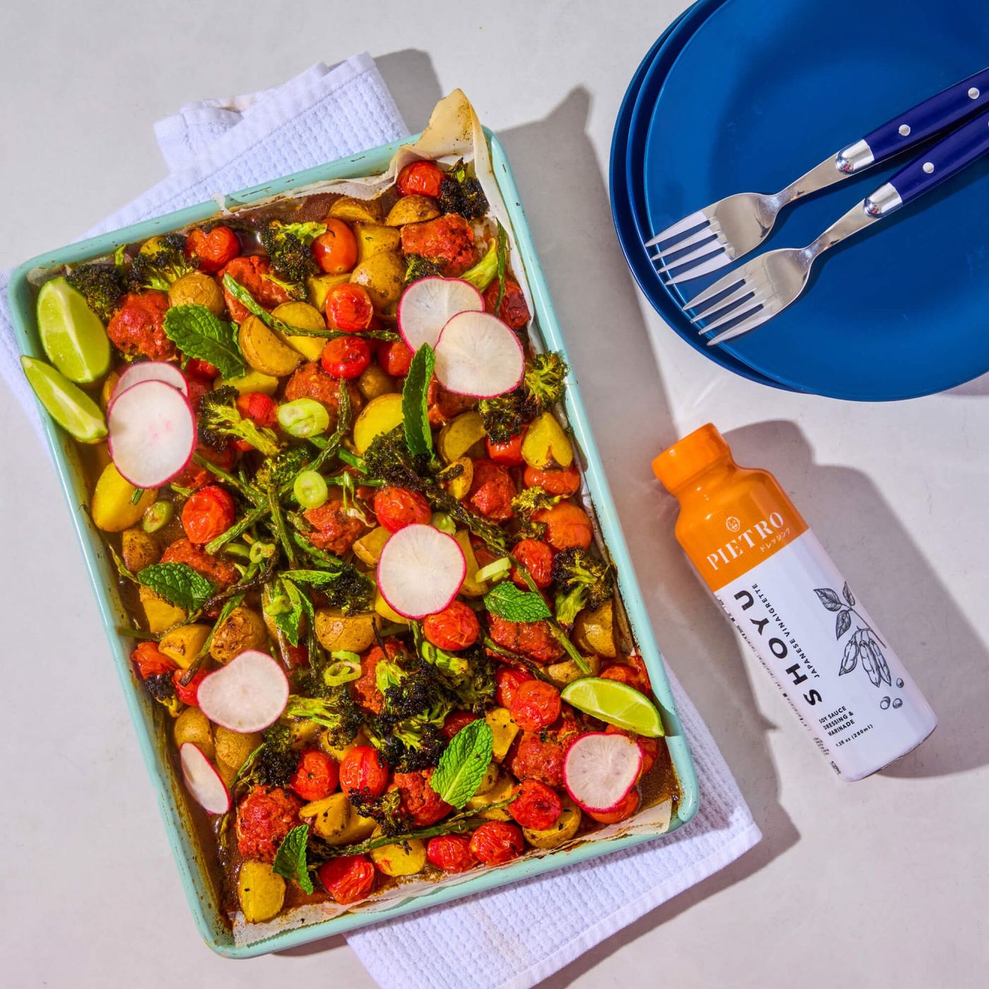 A tray of roasted vegetables with PIETRO Shoyu