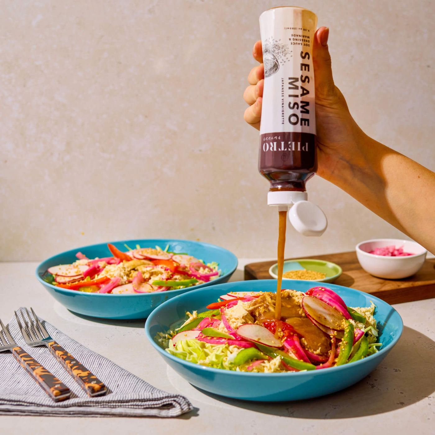 PIETRO Sesame Miso dressing poured over a salad